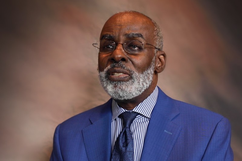 Image of an African American man wearing a blue suit
