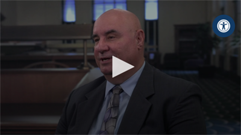 Man wearing a grey suit.