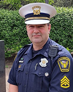 Image of a man wearing a police uniform.